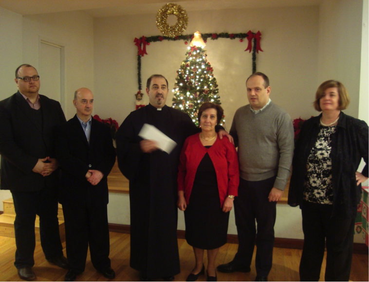 Pastor and Board of Trustees accepting a check from Ms. Meline Najarian, chairlady of the Ladies Guild