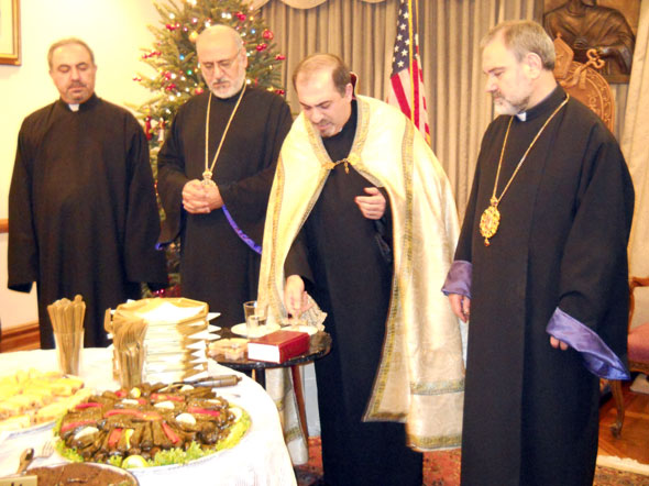 Rev. Fr. Mesrob Lakissian, pastor of St. Illuminator’s Cathedral, leads the traditional Home Blessing ceremony at the Prelacy during the Prelate’s annual Christmas reception. Attending clergy included Bishop Anoushavan Tanielian, Vicar; Archpriest Fr. Moushegh Der Kaloustian, Pastor Emeritus of St. Illuminator’s Cathedral, and Rev. Fr. Hovnan Bozoian, pastor of Sts. Vartanantz Church, Ridgefield, New Jersey.